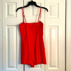 Beautiful Red Romper with bow and zip in front.  ASTR label